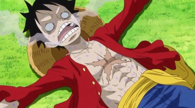 Luffy ăn phải cá bị trúng độc và nằm bất tỉnh